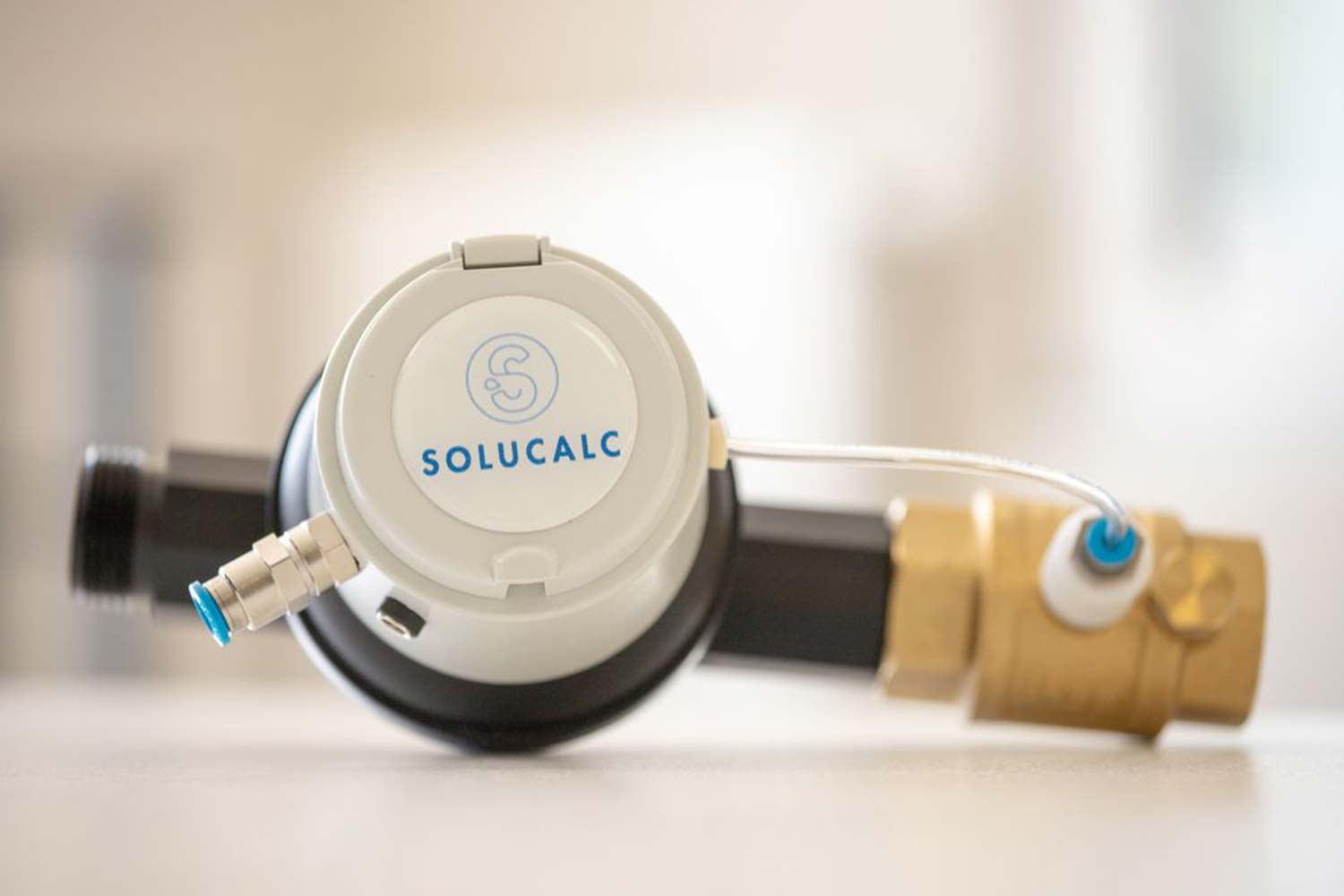SoluCalc unit mounted on a water line